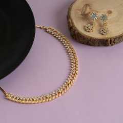 Set of gold plated diamond necklace and earring