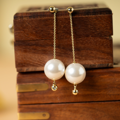 Dangling pearl drop earrings