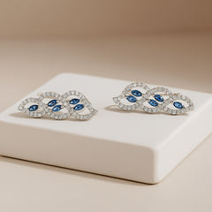 925 Sterling Silver Rhodium Plated Twisted Leaf Ear Cuffs with Blue Cubic Zirconia