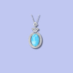 Elegant Turquoise Oval Pendant in 925 Sterling Silver with Double Halo